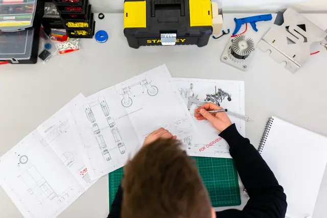 Industrial specialists reviewing production information